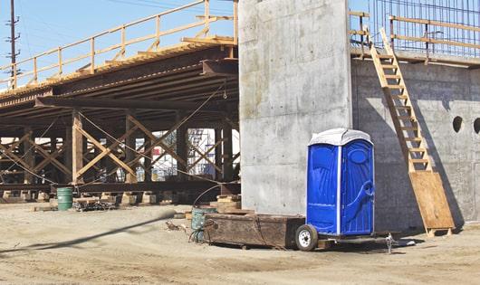 easily accessible portable toilets at a work site, saving workers from long walks to a permanent restroom